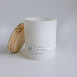 candle in white glass jar with bamboo lid