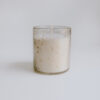 candle in textured glass jar professionally photographed