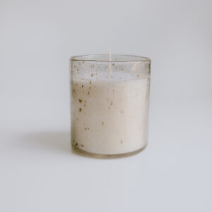 candle in textured glass jar professionally photographed