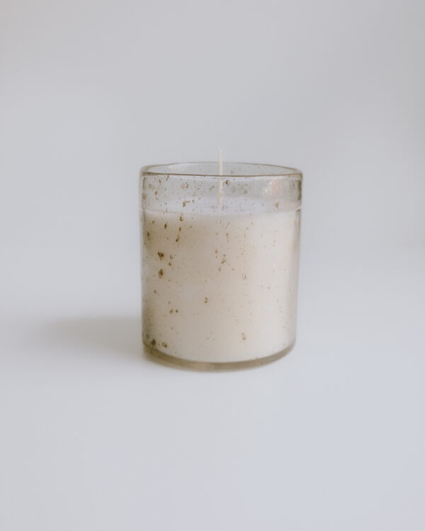 candle in textured glass jar professionally photographed