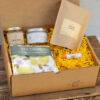 Lemon Edition Gift Box with artisan ginger lemon tea, lemon tea towel, lemon poppyseed candle, creamed honey, and natural chapstick from Lancaster County small businesses