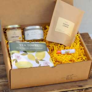 Lemon Edition Gift Box with artisan ginger lemon tea, lemon tea towel, lemon poppyseed candle, creamed honey, and natural chapstick from Lancaster County small businesses