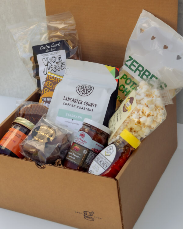 Deluxe Taste of Lancaster Gift Box featuring local Lancaster County products including coffee, pretzels, honey, popcorn, and apple butter.