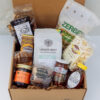 Deluxe Taste of Lancaster Gift Box featuring local Lancaster County products including coffee, pretzels, honey, popcorn, and apple butter.