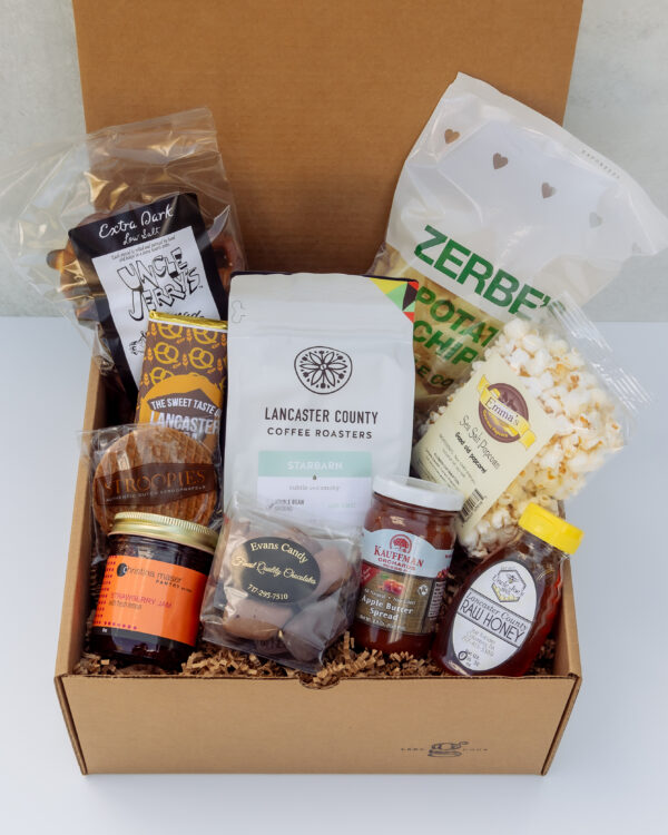 Deluxe Taste of Lancaster Gift Box featuring local Lancaster County products including coffee, pretzels, honey, popcorn, and apple butter.