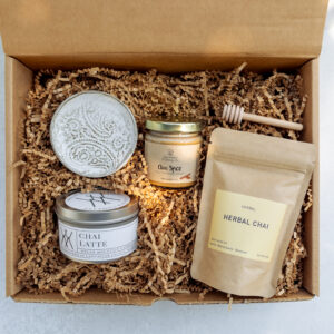 Chai Tea Edition Gift Box featuring local Lancaster County products including chai tea, honey, candle, and handmade pottery dish in kraft box.