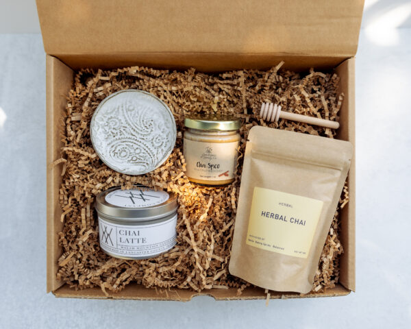 Chai Tea Edition Gift Box featuring local Lancaster County products including chai tea, honey, candle, and handmade pottery dish in kraft box.
