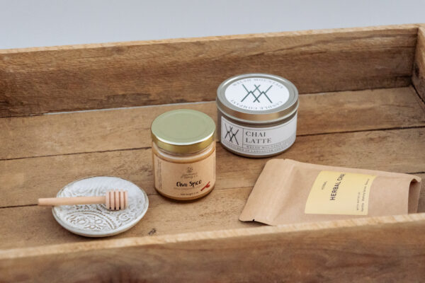 hai Tea Edition Gift Box featuring local Lancaster County products including chai tea, honey, candle, and handmade pottery dish in kraft box.