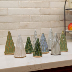 Group of handmade ceramic trees from LancGoods, created at Lancaster Creative Factory in assorted green, white, and blue glazes.