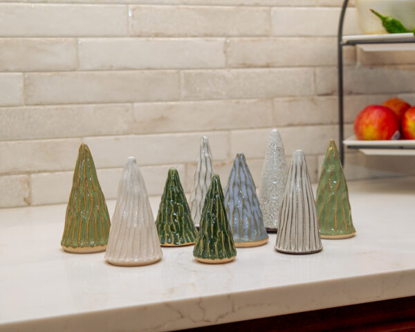 Group of handmade ceramic trees from LancGoods, created at Lancaster Creative Factory in assorted green, white, and blue glazes.