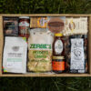 Deluxe Taste of Lancaster Gift Box featuring local Lancaster County products including coffee, pretzels, honey, popcorn, and apple butter.