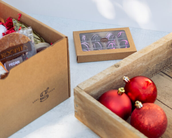 Deluxe Holiday Gift Box filled with Lancaster County products including coffee, candle, cookies, truffles, and holiday towel.